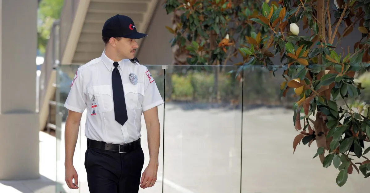 (security guard patrolling the premises of a building)
