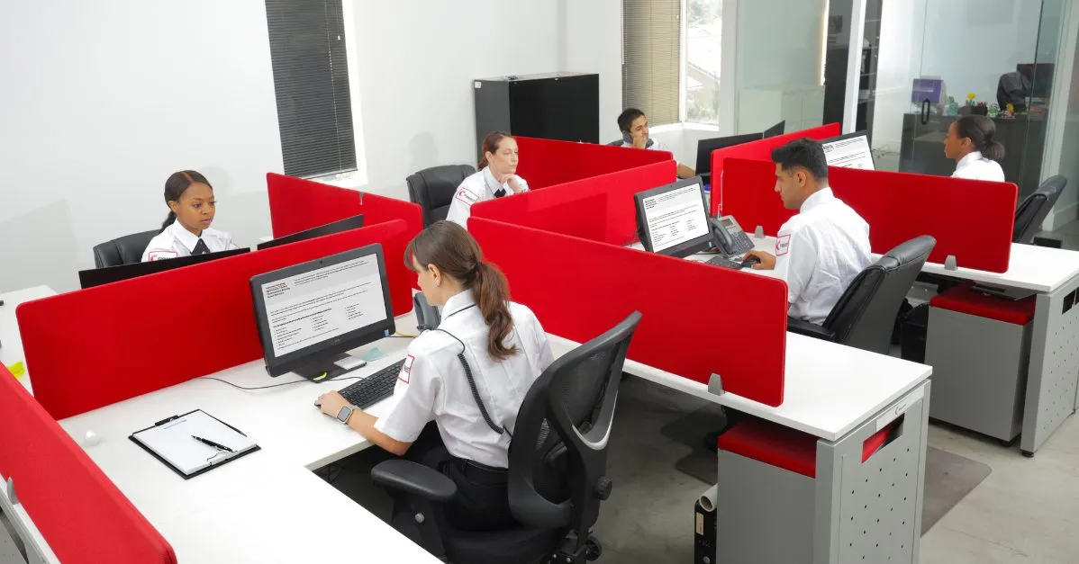 (professional security guards working on computers)