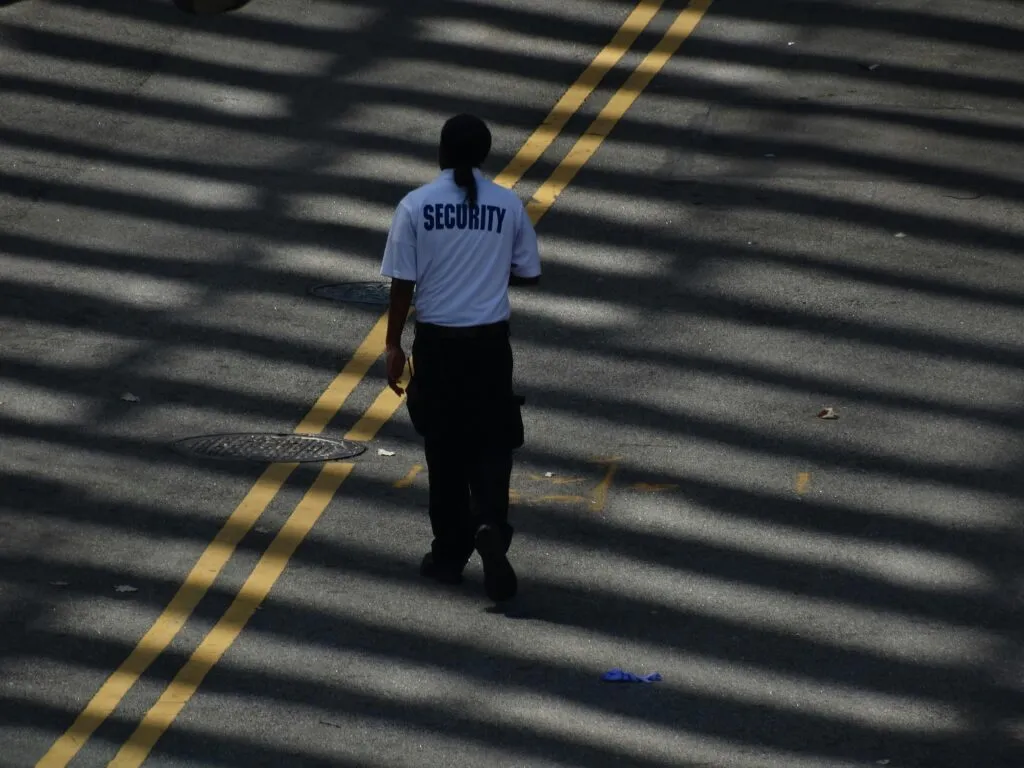 Marked security patrol vehicle checking a property
