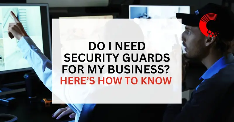 Two security professionals review surveillance footage on multiple monitors inside a dark control room.