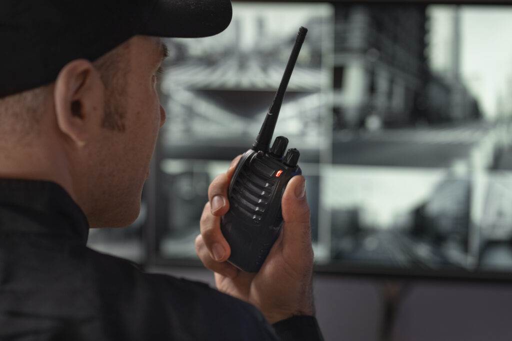 Security guard communicating with dispatch during an active patrol